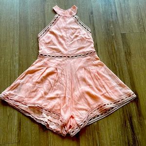 NWOT baby pink romper with cut out detailing at waist